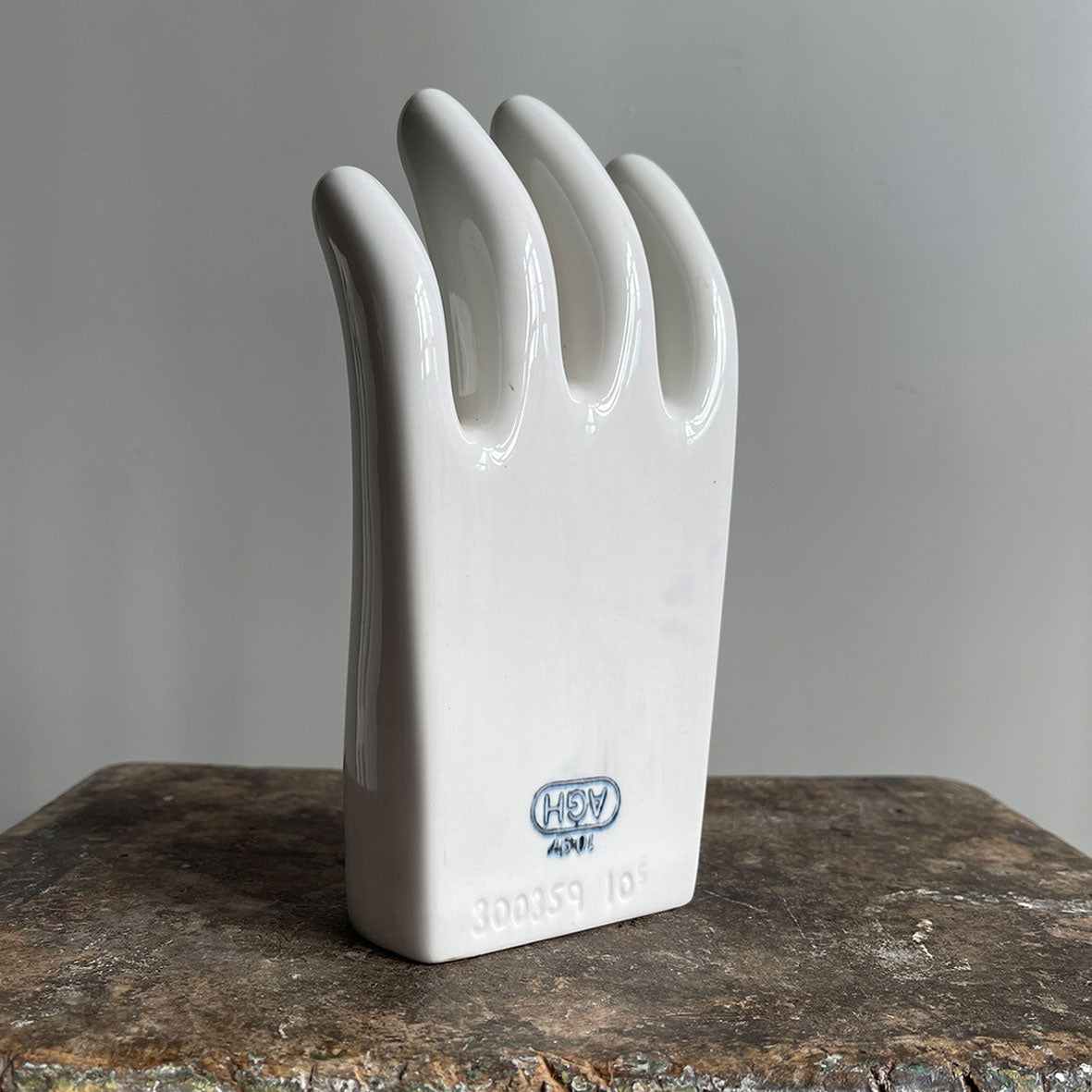 A sculptural Factory Glove Mould. Finished in a white glaze and stamped '300359 10' and 'AGH' printed in blue numerals to the front. In perfect condition - SHOP NOW - www.intovintage.co.uk