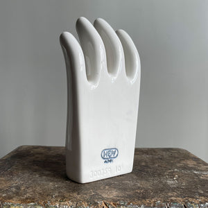 A sculptural Factory Glove Mould. Finished in a white glaze and stamped '300359 10' and 'AGH' printed in blue numerals to the front. In perfect condition - SHOP NOW - www.intovintage.co.uk