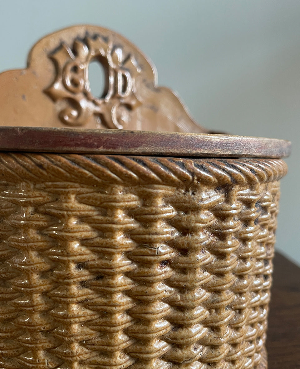 A delightful Late 19th Century Salt Box with a whicker design and hinged wooden lid. The word 'GOD' is visible on the back plate with the 'O' being the hole so that it can be mounted on the wall - SHOP NOW - www.intovintage.co.uk