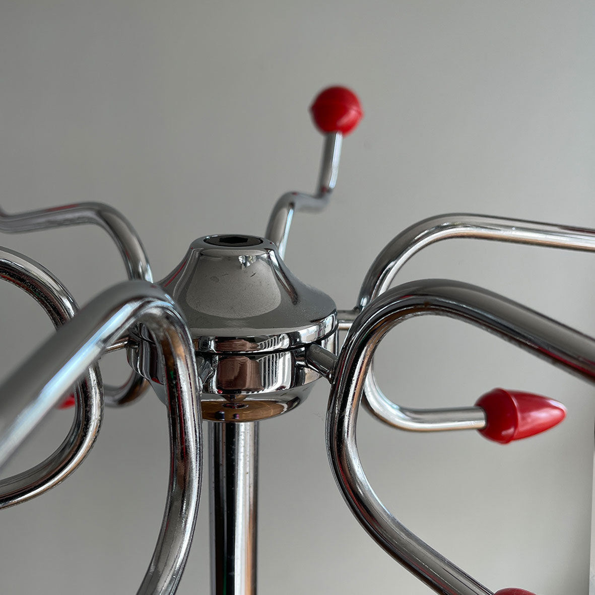 A cool looking Vintage HAGO 'Sputnik' Coat Rack from the 1960s. In a smart looking black, red and chrome colour combo. It has six main double red bobble hooks on the top section, three mini hooks on the stem, and a hoop ring for your umbrellas - SHOP NOW - www.intovintage.co.uk