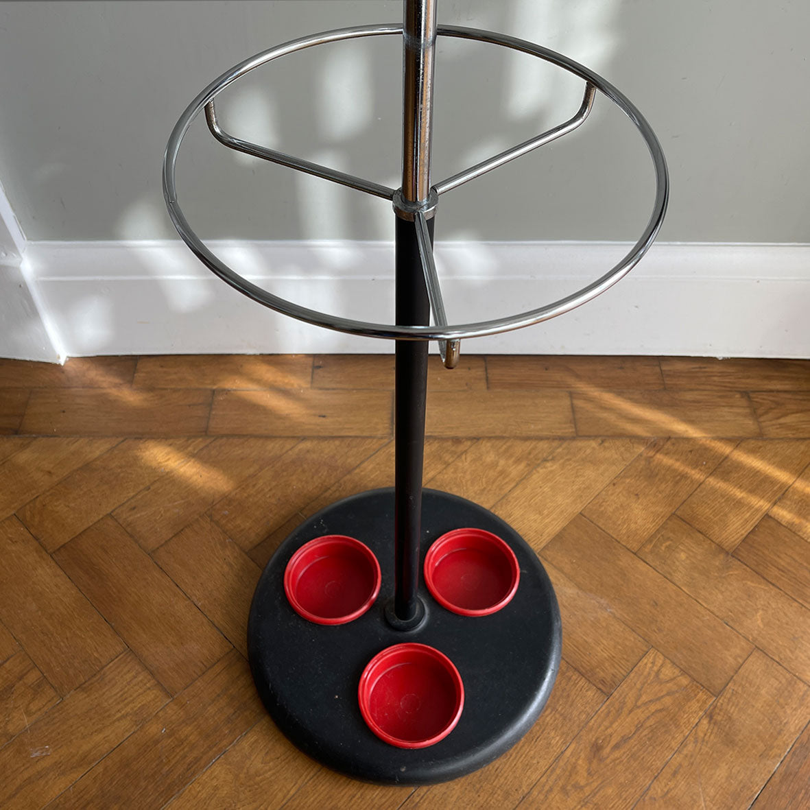 A cool looking Vintage HAGO 'Sputnik' Coat Rack from the 1960s. In a smart looking black, red and chrome colour combo. It has six main double red bobble hooks on the top section, three mini hooks on the stem, and a hoop ring for your umbrellas - SHOP NOW - www.intovintage.co.uk