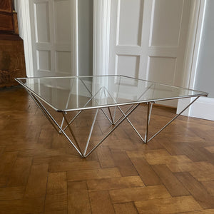 A stylish modernistic chromed square vintage coffee table in the Style of Paolo Piva circa 1980, Italy.Simple and elegant in form, the frame is made of chromed steel shaped connected triangles. Clear glass top - SHOP NOW - www.intovintage.co.uk