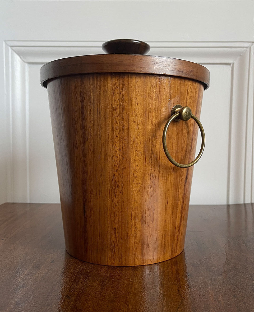 A very cool Vintage Scandinavian Teak Ice Bucket by KMC. Tapered to the base with two brass ring handles to the sides and a teak knob on the lid. Inside is aluminium lined to keep the ice nice and cold. Marked on the bottom with the horse logo - SHOP NOW - www.intovintage.co.uk