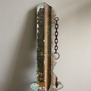 A large cast metal oversized Yale key with its original hanging chains, used as an advertisement display in locksmith shops and ironmongers. It has its original gilt paint finish that has weathered over the yeas to achieve the most amazing patinated finish. Hangs horizontal when suspended on its chains - SHOP NOW - www.intovintage.co.uk