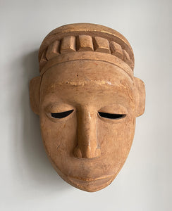 A good looking Tribal Mask. The face has a beautiful simplicity to it with slit eyes and a prominent nose. A stylised crown sits atop of the head. finely carved with a natural finish - SHOP NOW - www.intovintage.co.uk