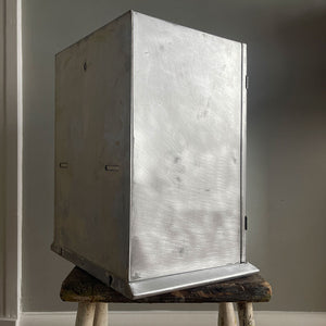 A Vintage Medical Cabinet from the 1930s with a Deco style chrome & bakelite handle to the door. The paint has been removed from the outside to leave a bare aluminium finish. The inside and shelf has its original cream finish - SHOP NOW - www.intovintage.co.uk