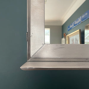 A Vintage Medical Cabinet from the 1930s with a Deco style chrome & bakelite handle to the door. The paint has been removed from the outside to leave a bare aluminium finish. The inside and shelf has its original cream finish - SHOP NOW - www.intovintage.co.uk