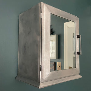 A Vintage Medical Cabinet from the 1930s with a Deco style chrome & bakelite handle to the door. The paint has been removed from the outside to leave a bare aluminium finish. The inside and shelf has its original cream finish - SHOP NOW - www.intovintage.co.uk