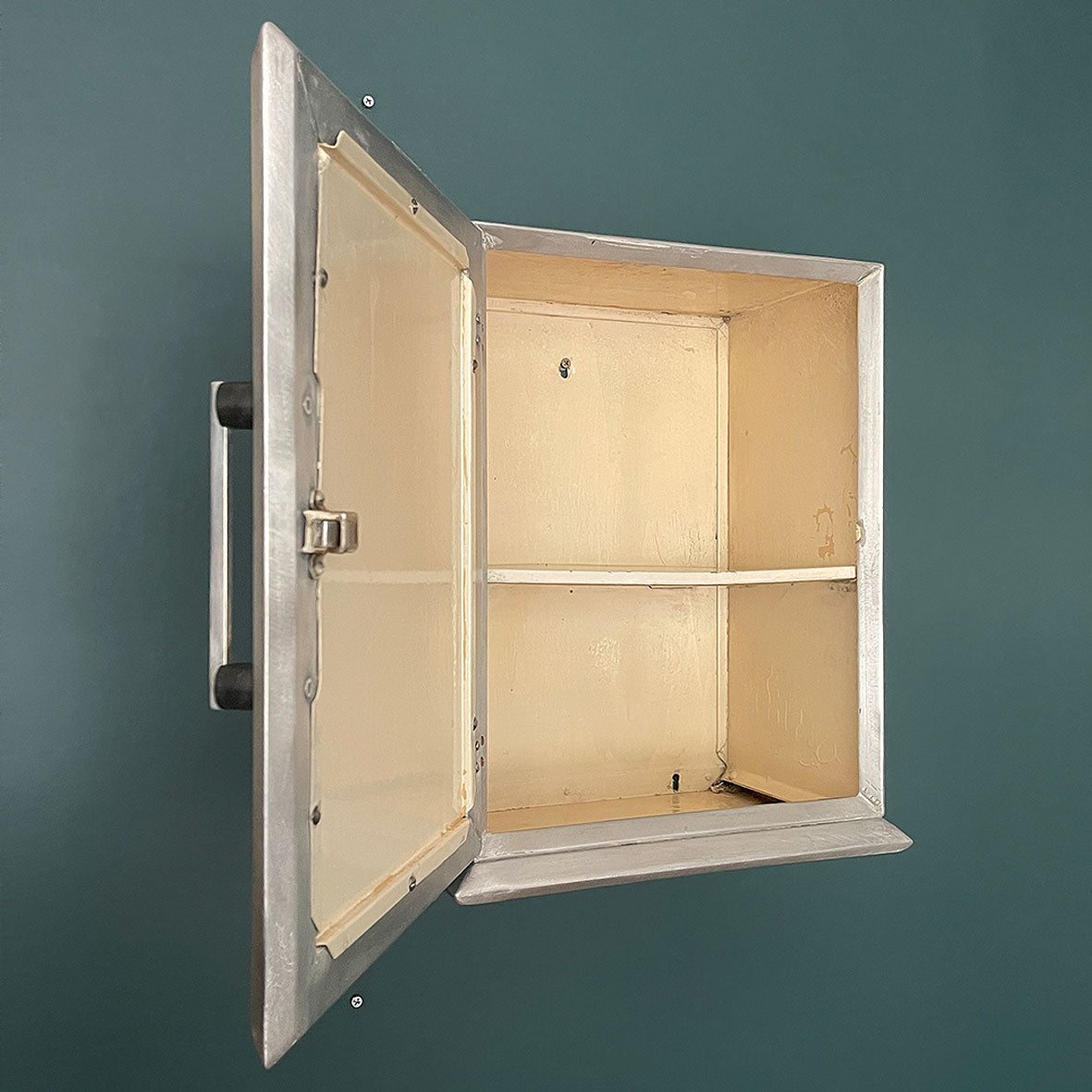 A Vintage Medical Cabinet from the 1930s with a Deco style chrome & bakelite handle to the door. The paint has been removed from the outside to leave a bare aluminium finish. The inside and shelf has its original cream finish - SHOP NOW - www.intovintage.co.uk
