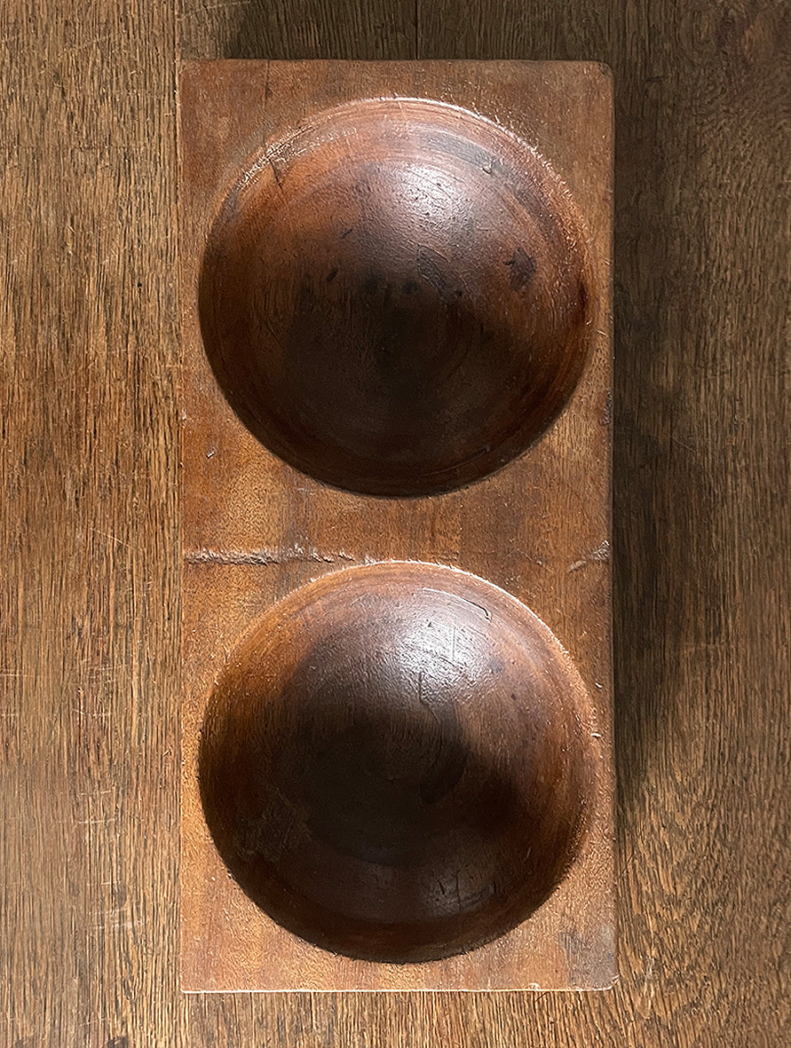 A 1930s Antique Money. Made of solid Mahogany, it has 2 deep bored bowls where money would have been kept. These trays were made to be used by shop keeps and market traders in the late 19th and early 20th century - SHOP NOW - www.intovintage.co.uk