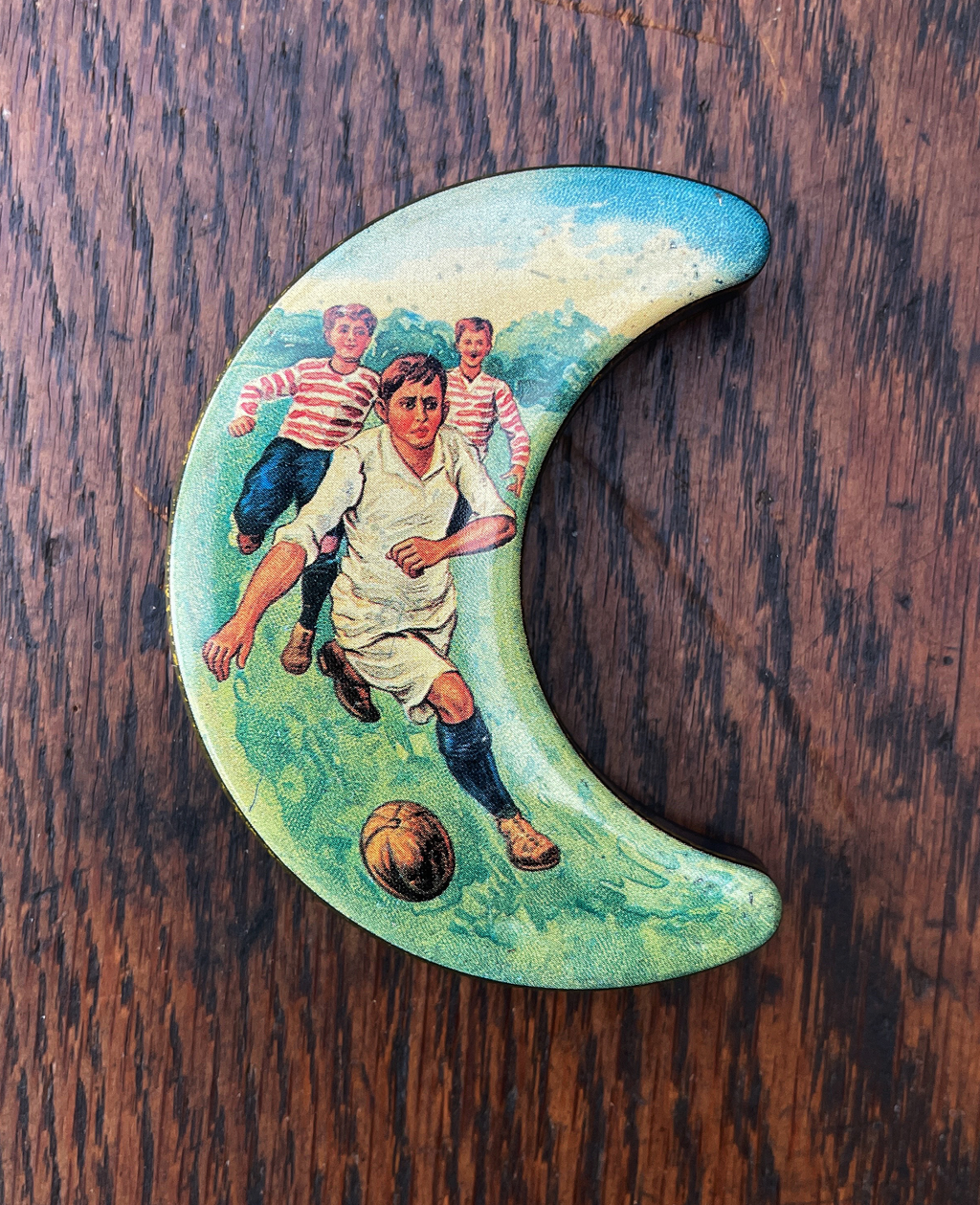 A little moon shaped continental sweet tin with football scene - SHOP NOW - www.intovintage.co.uk