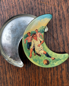 A little moon shaped continental sweet tin with football scene - SHOP NOW - www.intovintage.co.uk