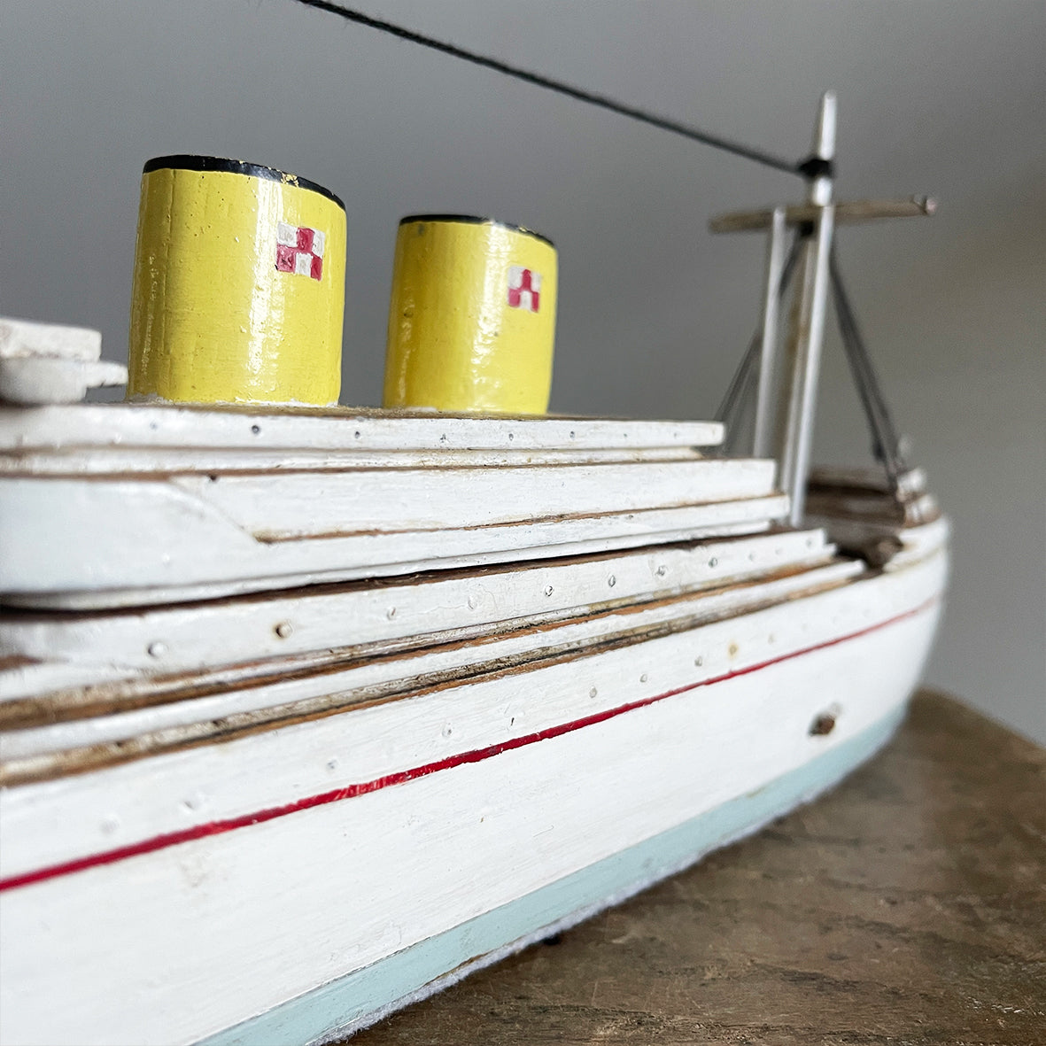 A delightful vintage scratch built Ship with a little secret. Wind her up and she plays a little ditty on an internal musical box. Based on the SS Empress of Britain she's a pretty little ship that would look great in a bathroom! SHOP NOW - www.intovintage.co.uk