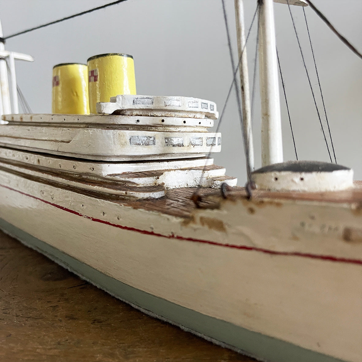 A delightful vintage scratch built Ship with a little secret. Wind her up and she plays a little ditty on an internal musical box. Based on the SS Empress of Britain she's a pretty little ship that would look great in a bathroom! SHOP NOW - www.intovintage.co.uk