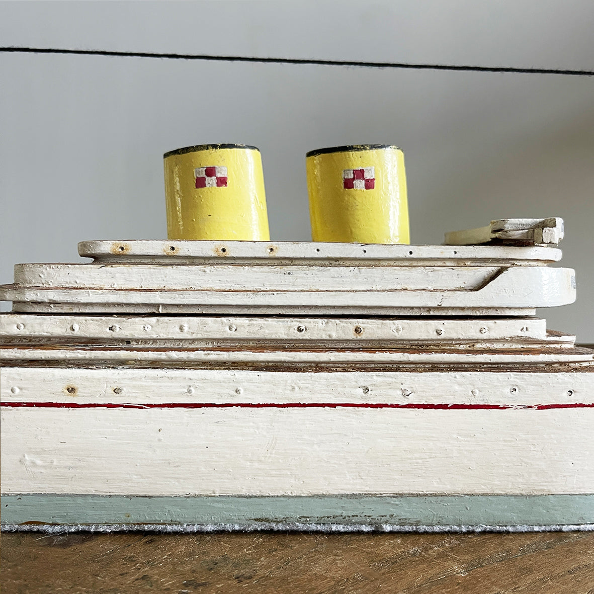 A delightful vintage scratch built Ship with a little secret. Wind her up and she plays a little ditty on an internal musical box. Based on the SS Empress of Britain she's a pretty little ship that would look great in a bathroom! SHOP NOW - www.intovintage.co.uk