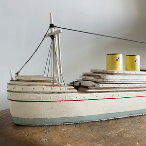 A delightful vintage scratch built Ship with a little secret. Wind her up and she plays a little ditty on an internal musical box. Based on the SS Empress of Britain she's a pretty little ship that would look great in a bathroom! SHOP NOW - www.intovintage.co.uk