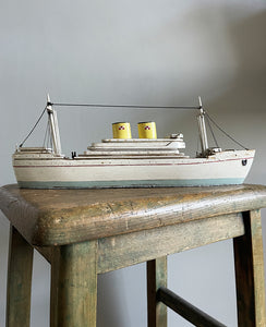 A delightful vintage scratch built Ship with a little secret. Wind her up and she plays a little ditty on an internal musical box. Based on the SS Empress of Britain she's a pretty little ship that would look great in a bathroom! SHOP NOW - www.intovintage.co.uk