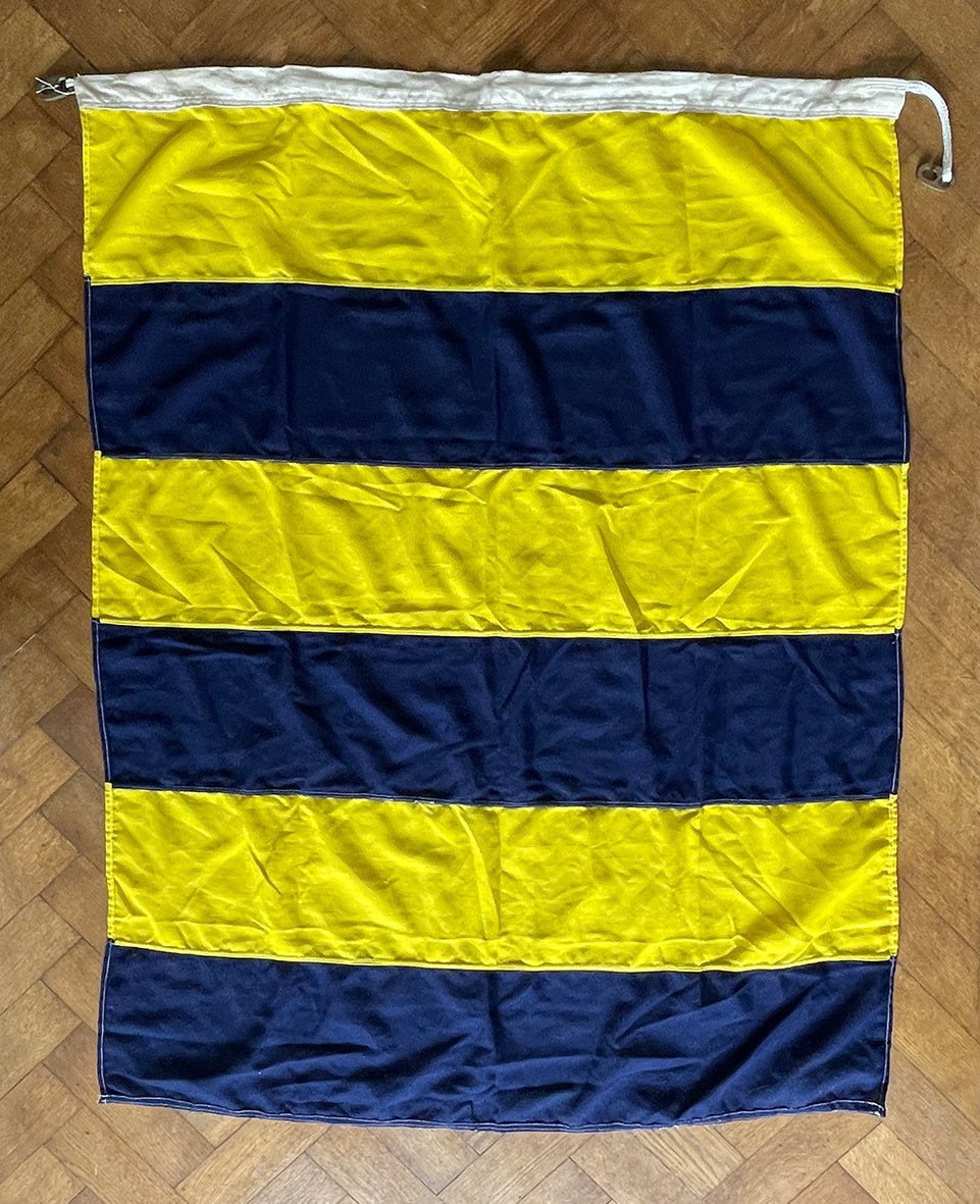 A Large Nautical Size 5 Flag. The blue and yellow stripes translate as 'G' in nautical code. The seem has two cast metal fasteners and cord, so can easily be hung. These flags look great framed and hung on the wall or, use it as a cool through or table cloth - SHOP NOW - www.intovintage.co.uk