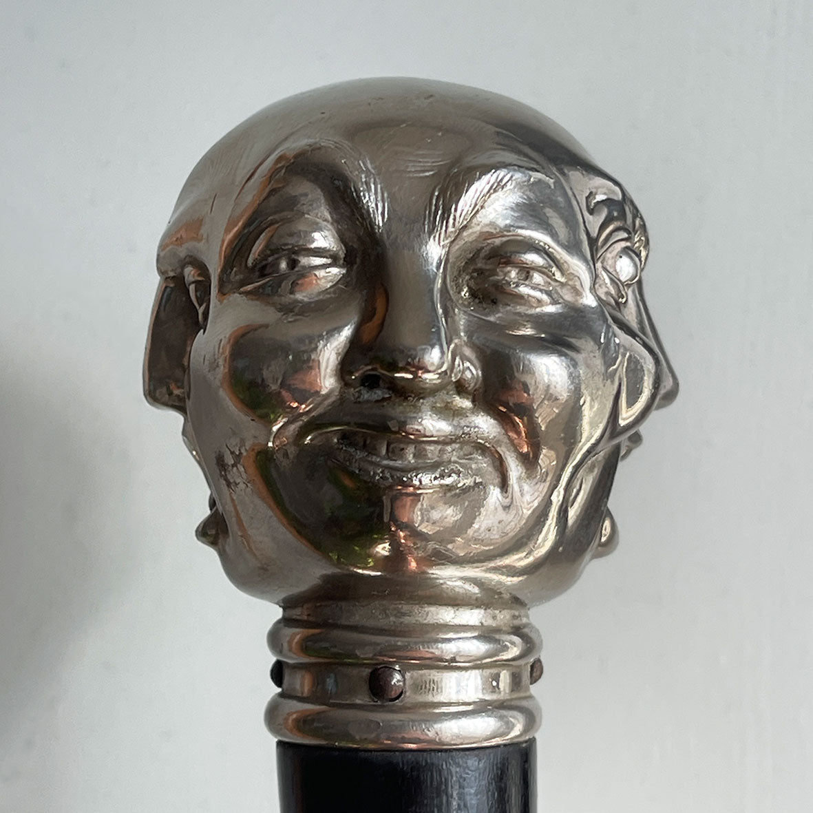 A Victorian Page Turner from around the 1870 period. A silvered head showing four characterful faces sits atop an ebonised wooden blade. The faces represent mirth, sadness, shock and anger - SHOP NOW - www.intovintage.co.uk