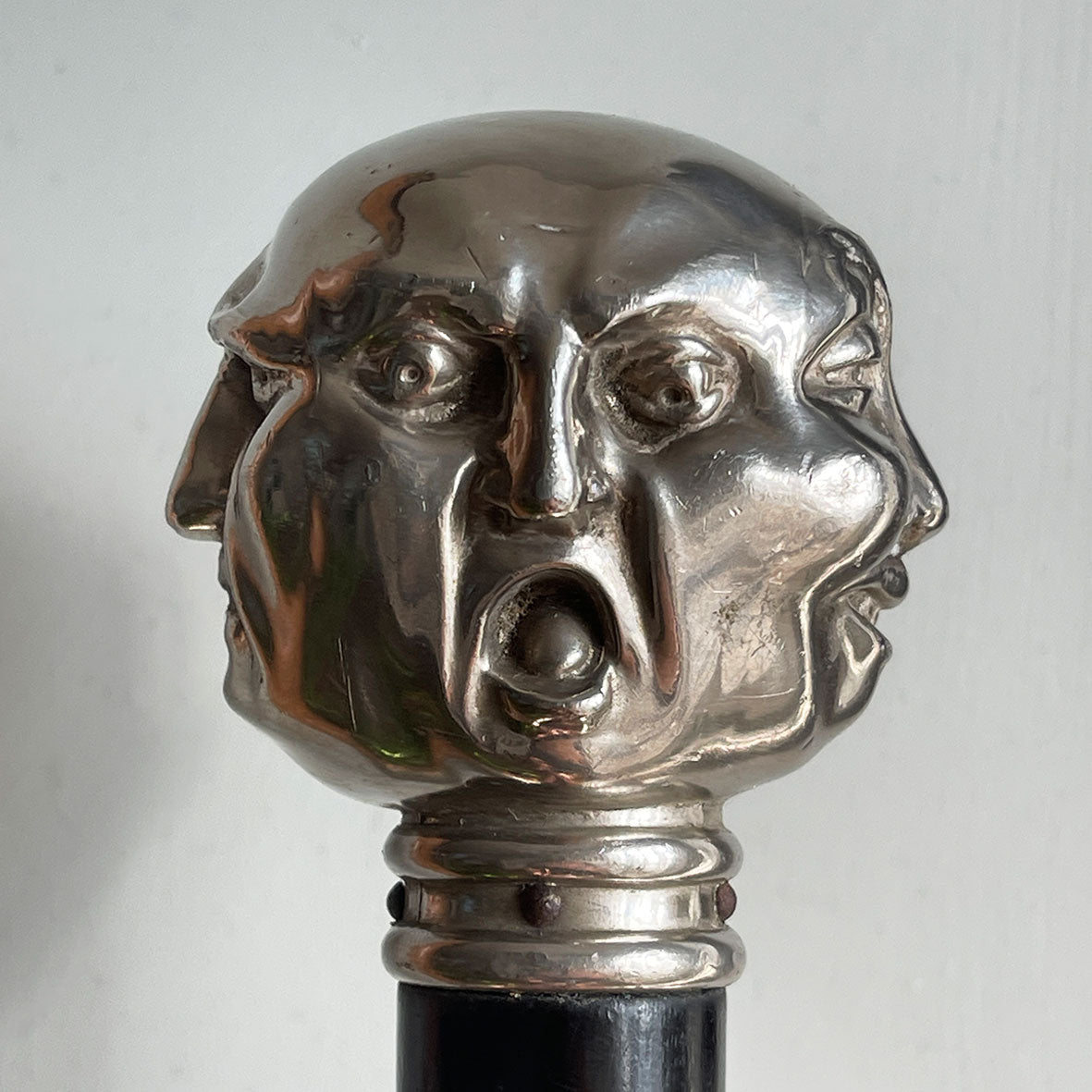 A Victorian Page Turner from around the 1870 period. A silvered head showing four characterful faces sits atop an ebonised wooden blade. The faces represent mirth, sadness, shock and anger - SHOP NOW - www.intovintage.co.uk