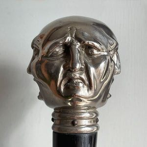 A Victorian Page Turner from around the 1870 period. A silvered head showing four characterful faces sits atop an ebonised wooden blade. The faces represent mirth, sadness, shock and anger - SHOP NOW - www.intovintage.co.uk