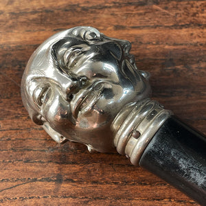 A Victorian Page Turner from around the 1870 period. A silvered head showing four characterful faces sits atop an ebonised wooden blade. The faces represent mirth, sadness, shock and anger - SHOP NOW - www.intovintage.co.uk