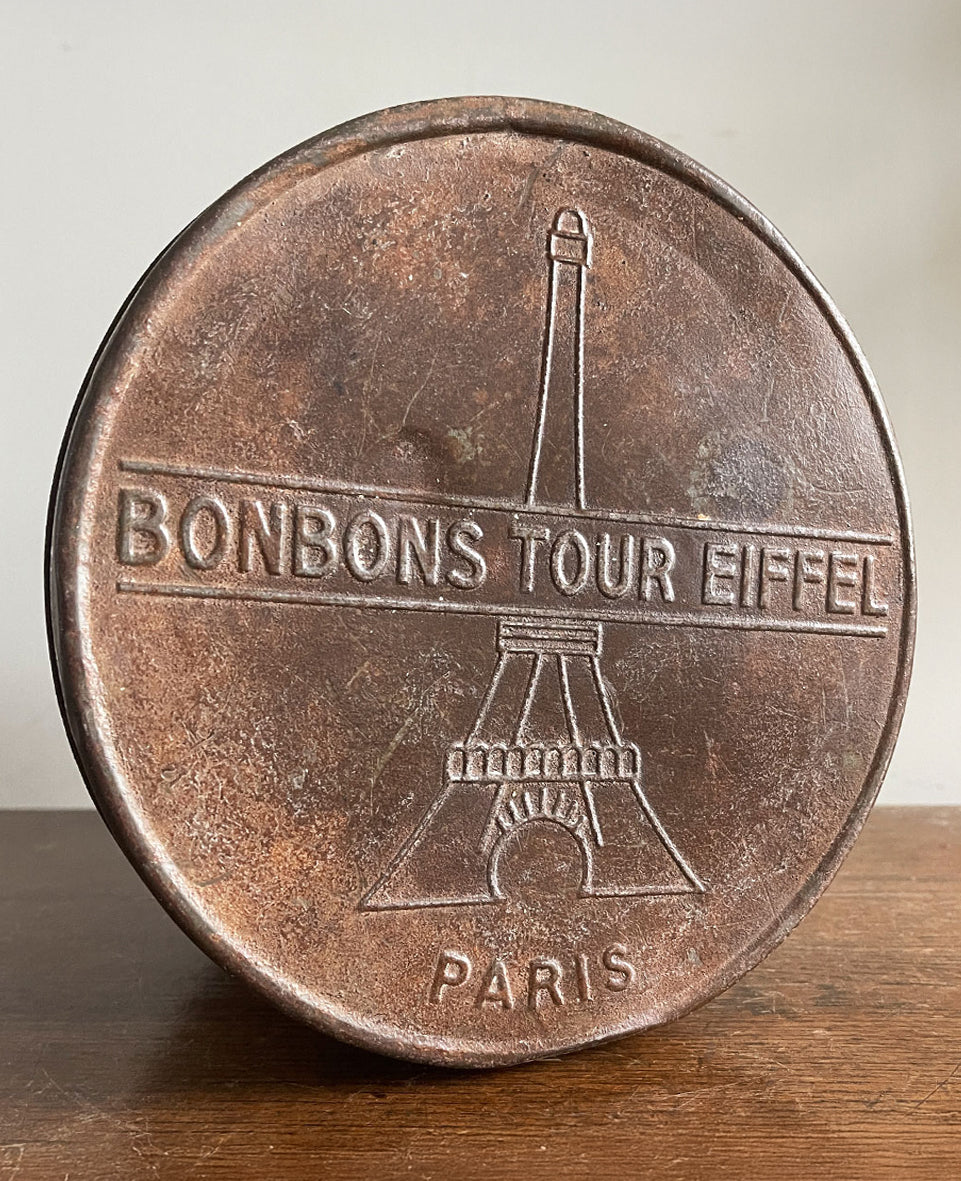 A large 1930s Tour Eiffel Bon Bon shop Tin by Pierrot Gourmand. Great embossed graphics to the lid - SHOP NOW - www.intovintage.co.uk