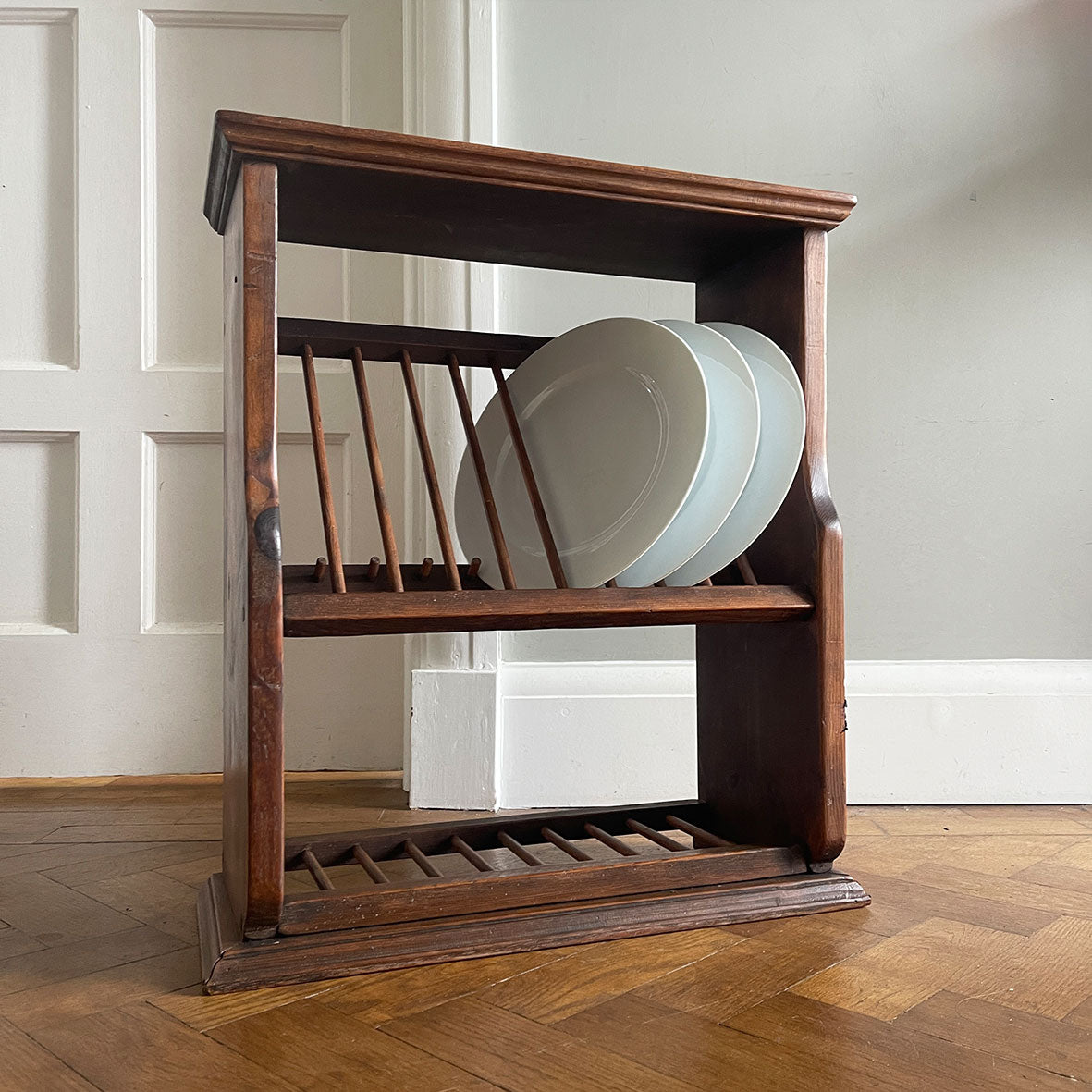 A Vintage Penny Pine Plate Rack perfect for the country farmhouse kitchen. It has a lovely deep dark pine colour too it and an old Victorian One Penny piece inset into the top - SHOP NOW - www.intovintage.co.uk