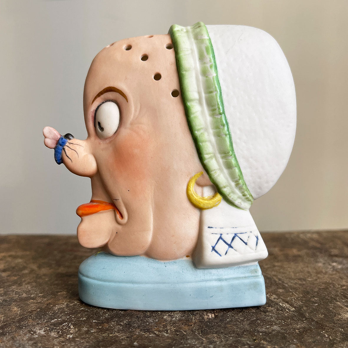 A rare German Porcelain Smoking Ashtray by Schafer & Vater. These unusual objects were used as ashtrays with the smoke of the cigarette escaping through the pierced holes. This one sees an old ugly maid with a fly perched on her nose! SHOP NOW - www.intovintage.co.uk