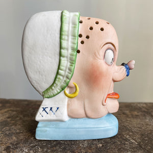 A rare German Porcelain Smoking Ashtray by Schafer & Vater. These unusual objects were used as ashtrays with the smoke of the cigarette escaping through the pierced holes. This one sees an old ugly maid with a fly perched on her nose! SHOP NOW - www.intovintage.co.uk