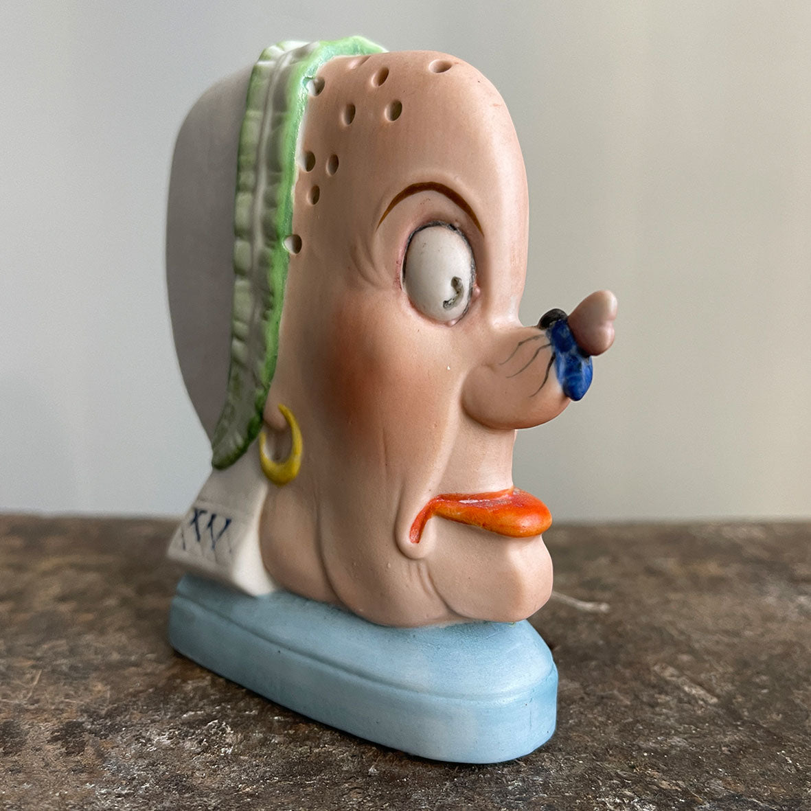 A rare German Porcelain Smoking Ashtray by Schafer & Vater. These unusual objects were used as ashtrays with the smoke of the cigarette escaping through the pierced holes. This one sees an old ugly maid with a fly perched on her nose! SHOP NOW - www.intovintage.co.uk