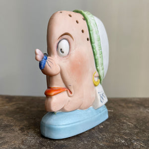 A rare German Porcelain Smoking Ashtray by Schafer & Vater. These unusual objects were used as ashtrays with the smoke of the cigarette escaping through the pierced holes. This one sees an old ugly maid with a fly perched on her nose! SHOP NOW - www.intovintage.co.uk