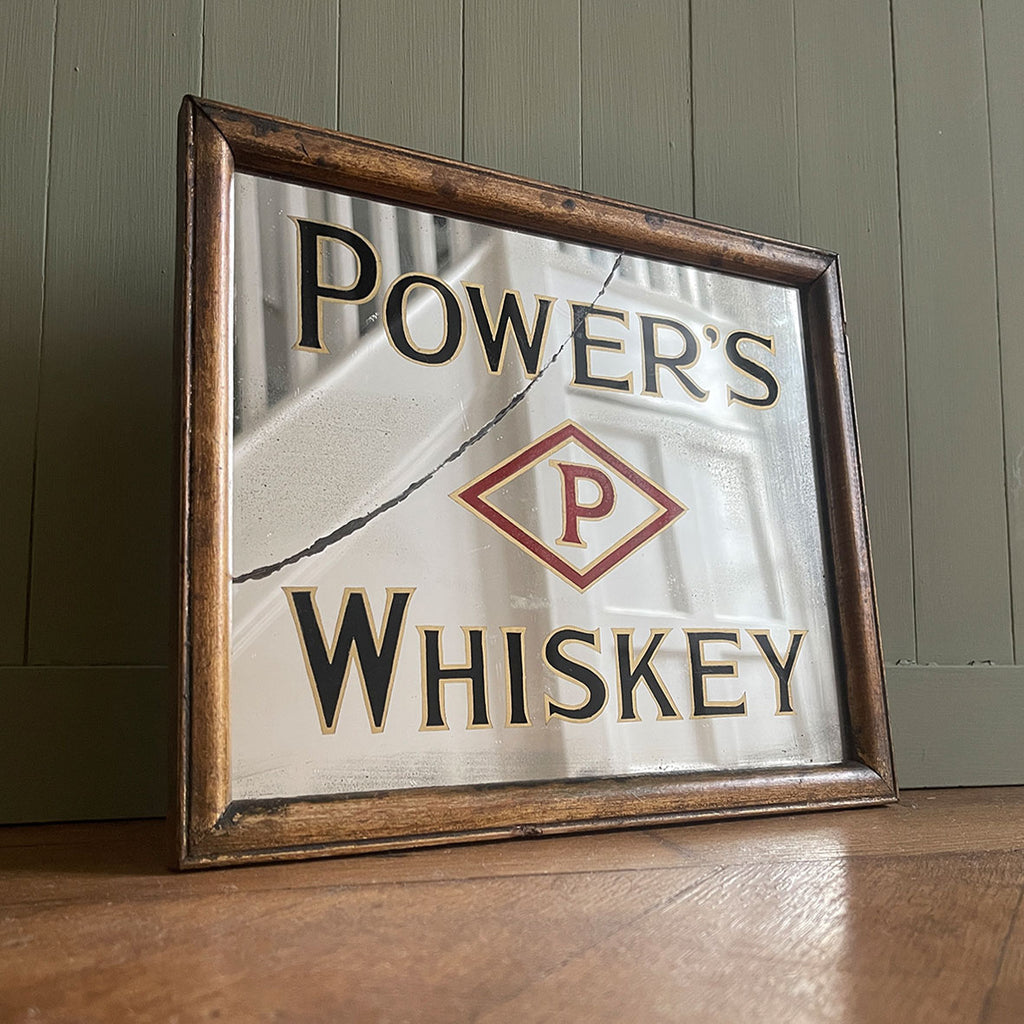 An Advertising Mirror for the Irish Power's Whiskey Company. Strong stylish typography and diamond graphic and great wear to the mirror plate. Original frame - SHOP NOW - www.intovintage.co.uk
