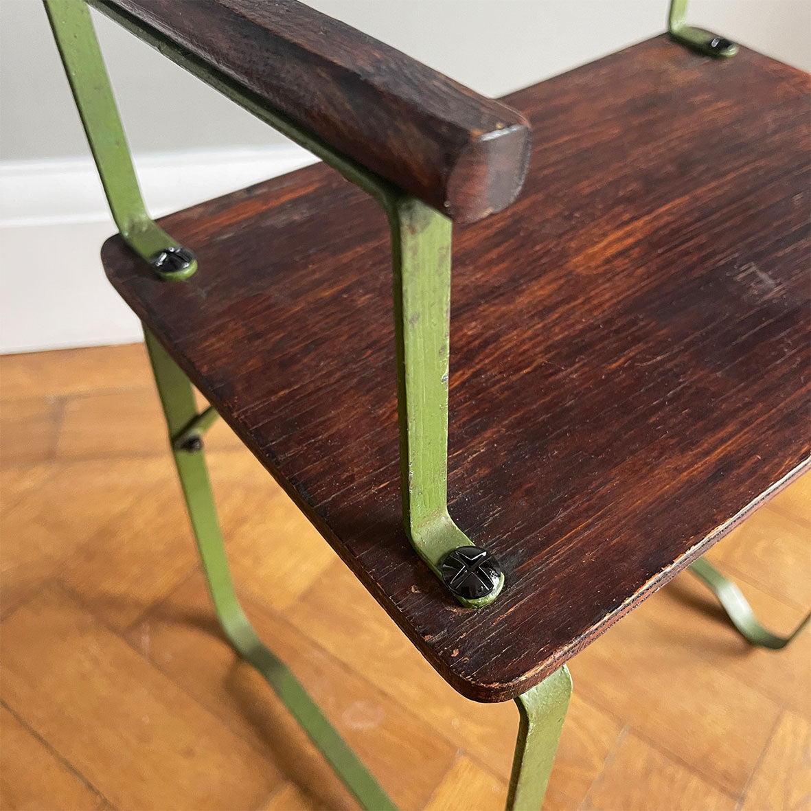 A 1950's scratch built chair sized for a small child. Of steel construction with ply seat, arms and back rest. Still in its original green paint - SHOP NOW - www.intovintage.co.uk