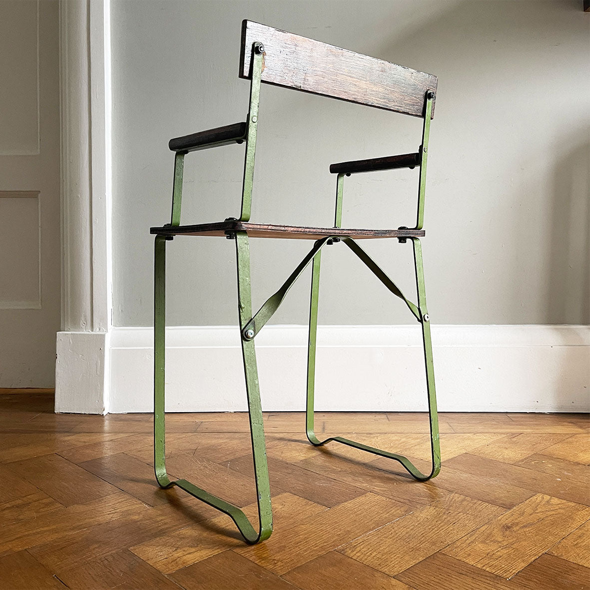 A 1950's scratch built chair sized for a small child. Of steel construction with ply seat, arms and back rest. Still in its original green paint - SHOP NOW - www.intovintage.co.uk