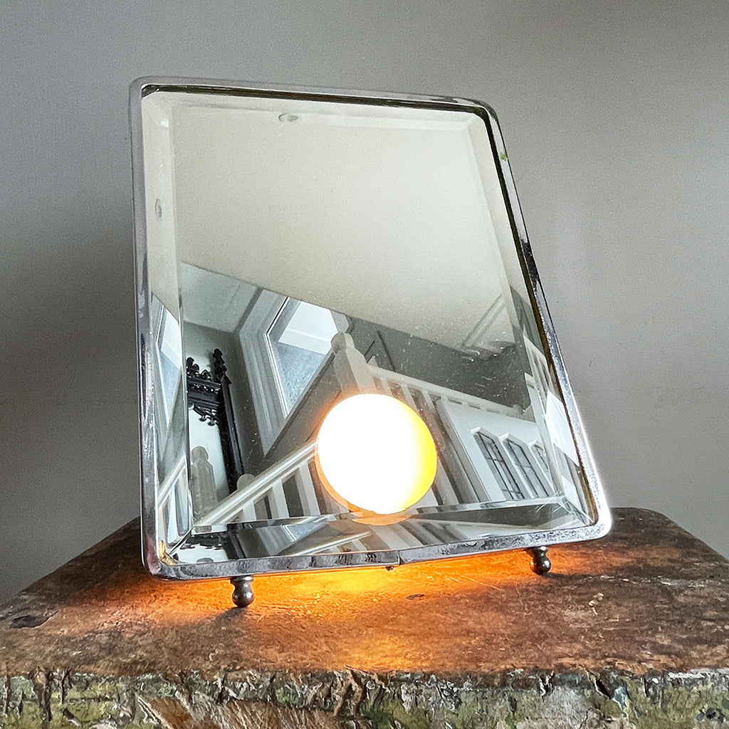 A stylish Art Deco Vanity Mirror that is lit from behind that creates a gorgeous soft defused light. The frame is nickel plated and has an electrical bulb fitting which has been re-wired with black vintage look cord flex - SHOP NOW - www.intovintage.co.uk