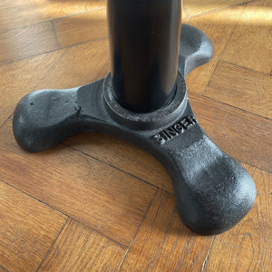 An Antique Singer Work Stool. It has a cast iron tripod base with the SINGER brand mark, a black painted steel stem and original turned wooden button seat. The wood shows fantastic age related patina. A great looking stool that would compliment any setting - SHOP NOW - www.intovintage.co.uk