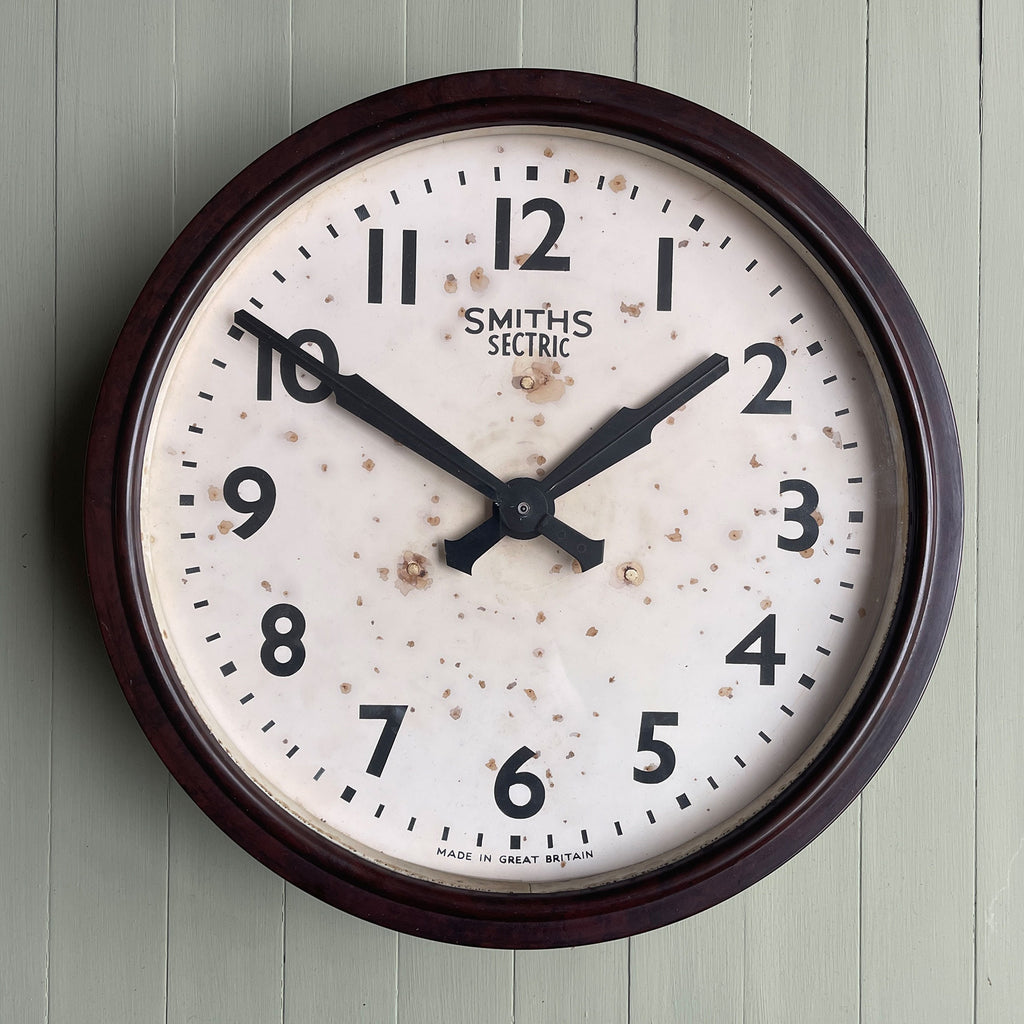 A Vintage Smith's 'Sectric' Wall Clock from the 1940s, made by the English clock company Smiths.. Made from brown Bakelite which is in nice clean condition having been polished and waxed, with an off white dial and retaining its original hands - SHOP NOW - www.intovintage.co.uk