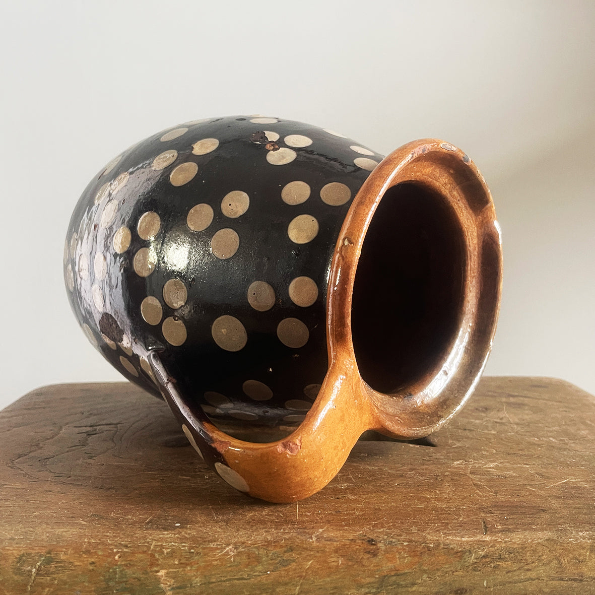 An Early Spotty Earthenware Jug in a gorgeous dark chocolate brown colour with a hand applied 3 dot repeat decoration - SHOP NOW - www.intovintage.co.uk