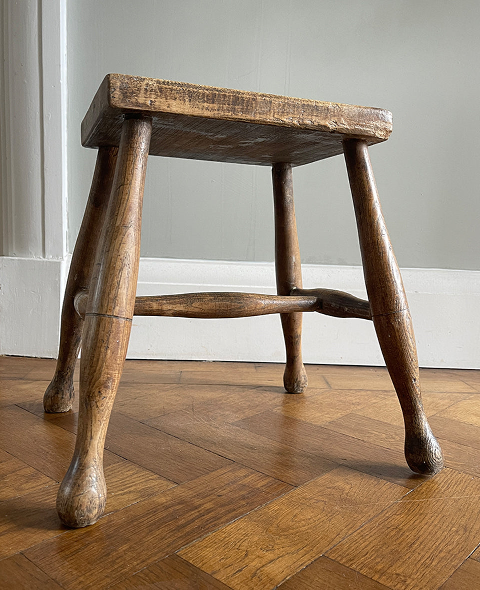 A beautiful time-worn 19th century provincial Beech stool. The rectangular beech top is raised on four turned beech supports united by a four beech stretchers - SHOP NOW - www.intovintage.co.uk