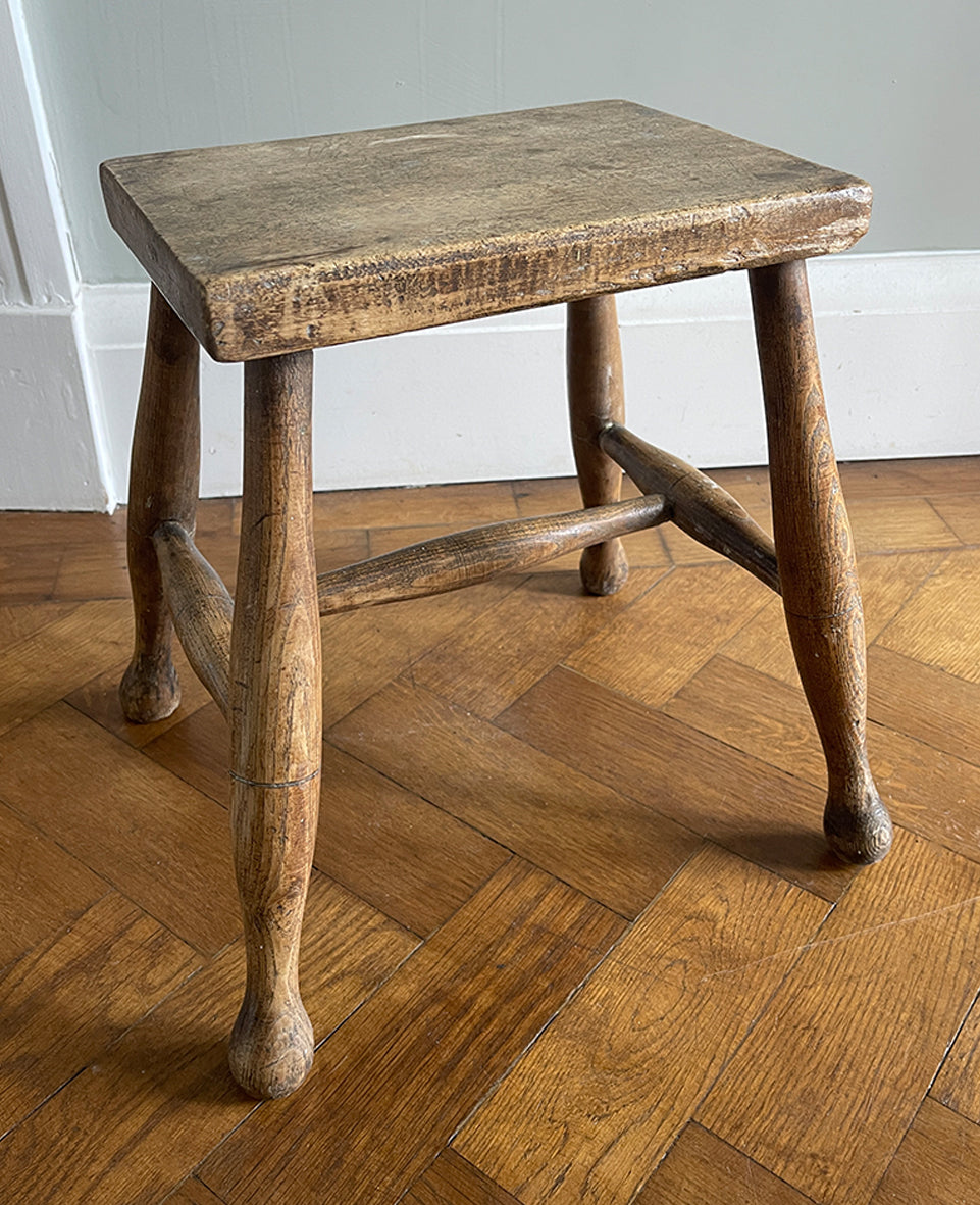 A beautiful time-worn 19th century provincial Beech stool. The rectangular beech top is raised on four turned beech supports united by a four beech stretchers - SHOP NOW - www.intovintage.co.uk
