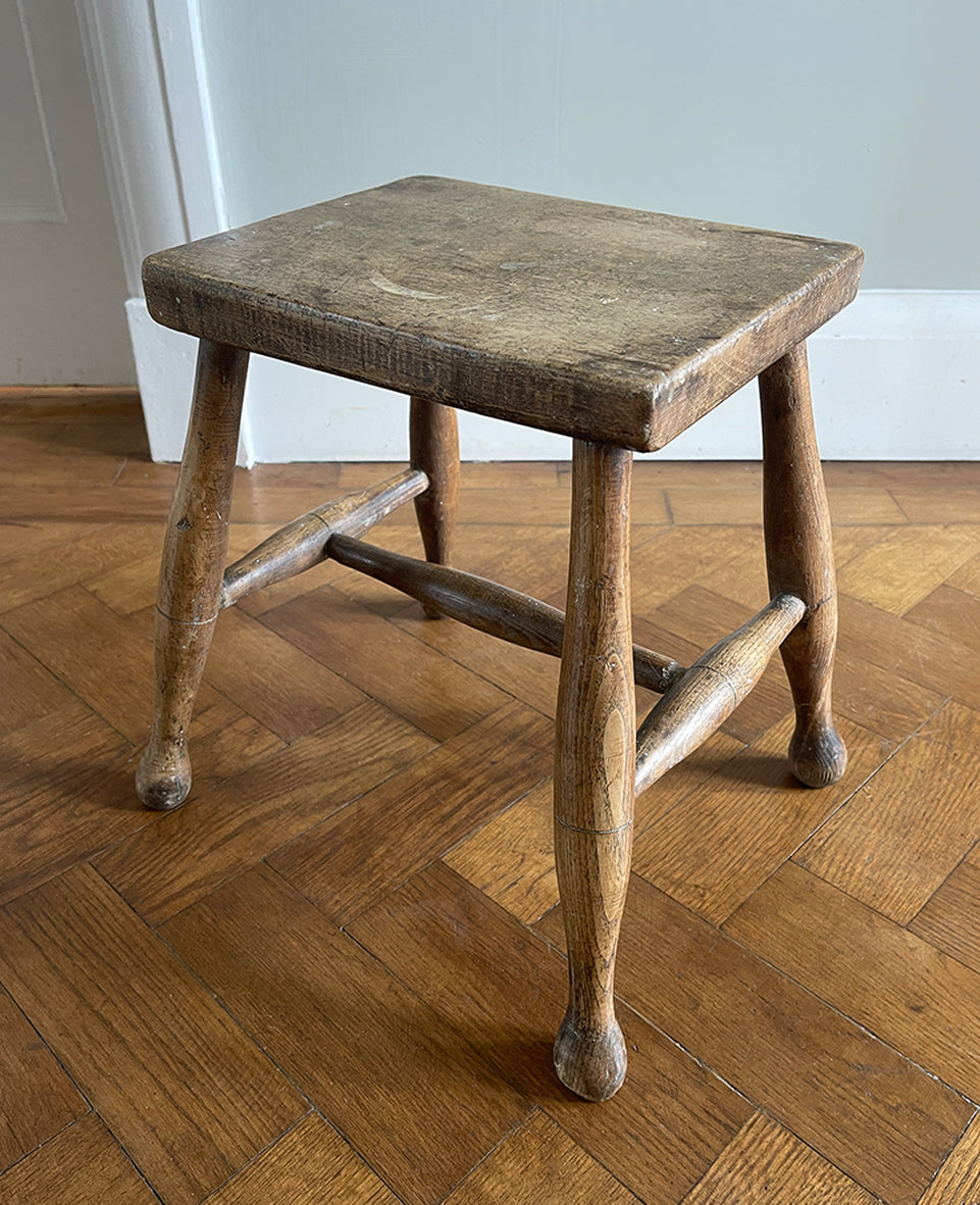 A beautiful time-worn 19th century provincial Beech stool. The rectangular beech top is raised on four turned beech supports united by a four beech stretchers - SHOP NOW - www.intovintage.co.uk