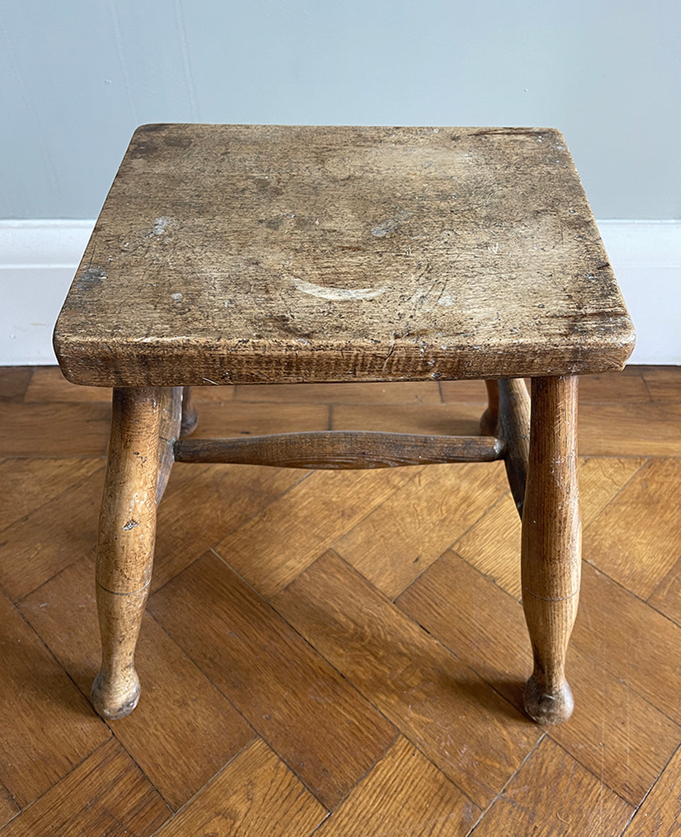 A beautiful time-worn 19th century provincial Beech stool. The rectangular beech top is raised on four turned beech supports united by a four beech stretchers - SHOP NOW - www.intovintage.co.uk