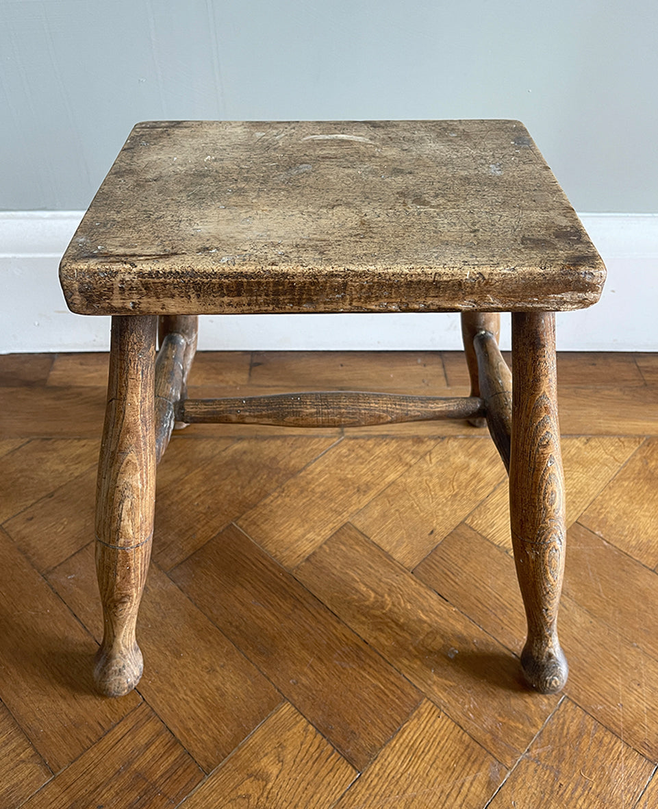 A beautiful time-worn 19th century provincial Beech stool. The rectangular beech top is raised on four turned beech supports united by a four beech stretchers - SHOP NOW - www.intovintage.co.uk