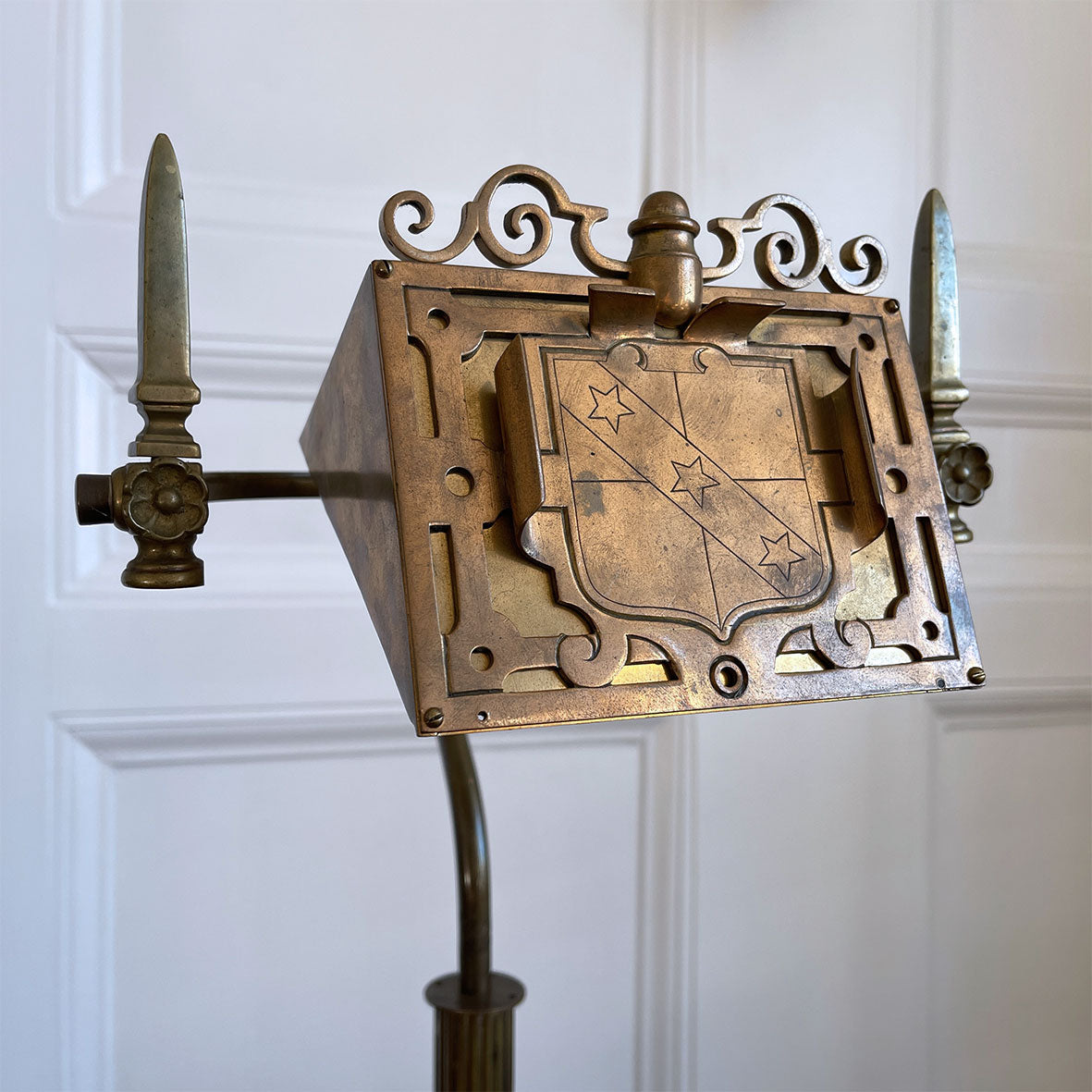 An interesting Gothic Brass Table Lamp with coat of arms to the front. The lamp sits a-top a brass fluted column base with swan neck. Wired for electricity with antique fabric covered cable, new plug and pat tested. - SHOP NOW - www.intovintage.co.uk