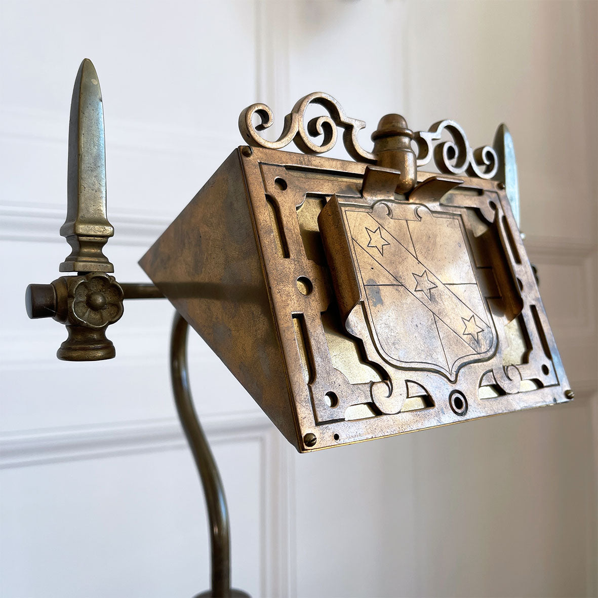 An interesting Gothic Brass Table Lamp with coat of arms to the front. The lamp sits a-top a brass fluted column base with swan neck. Wired for electricity with antique fabric covered cable, new plug and pat tested. - SHOP NOW - www.intovintage.co.uk