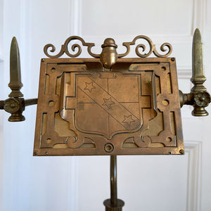 An interesting Gothic Brass Table Lamp with coat of arms to the front. The lamp sits a-top a brass fluted column base with swan neck. Wired for electricity with antique fabric covered cable, new plug and pat tested. - SHOP NOW - www.intovintage.co.uk