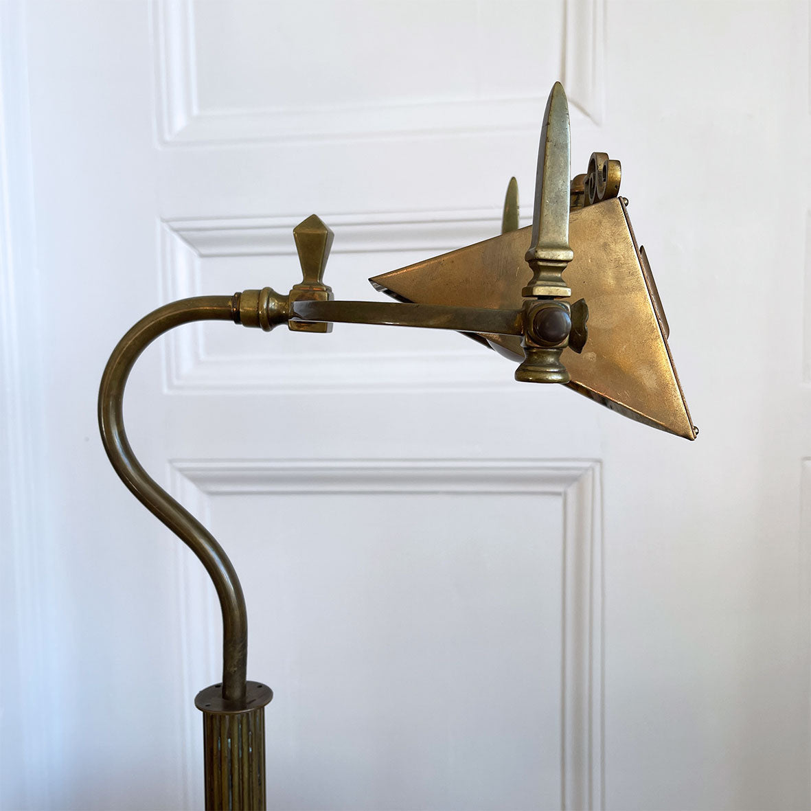 An interesting Gothic Brass Table Lamp with coat of arms to the front. The lamp sits a-top a brass fluted column base with swan neck. Wired for electricity with antique fabric covered cable, new plug and pat tested. - SHOP NOW - www.intovintage.co.uk