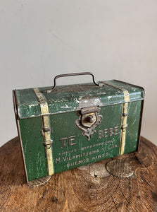 A 'Te Bebe' Buenos Aires Tea Tin in the shape of miniature steamer trunk. It has a little handle on the top lid and each end sees an embossed image of a child carrying a tea box. A rare tin that has travelled all the way from Argentina - SHOP NOW - www.intovintage.co.uk