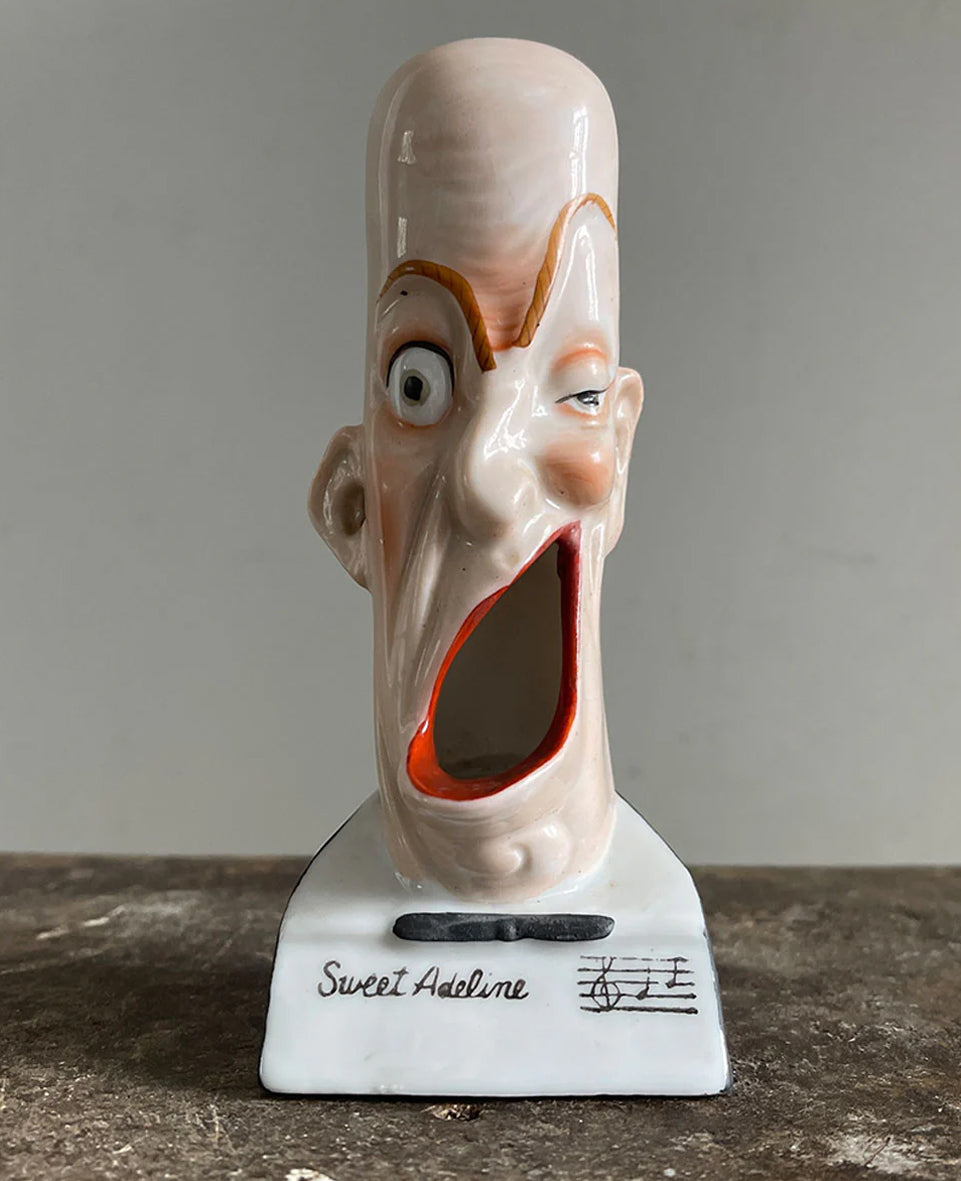 A rare German Porcelain Smoking Ashtray by Schafer &amp; Vater. These unusual objects were used as ashtrays with the smoke of the cigarette escaping through the ear holes. This one sees an old ugly chap with a big old eye and a title that reads 'Sweet Adeline' - SHOP NOW - www.intovintage.co.uk